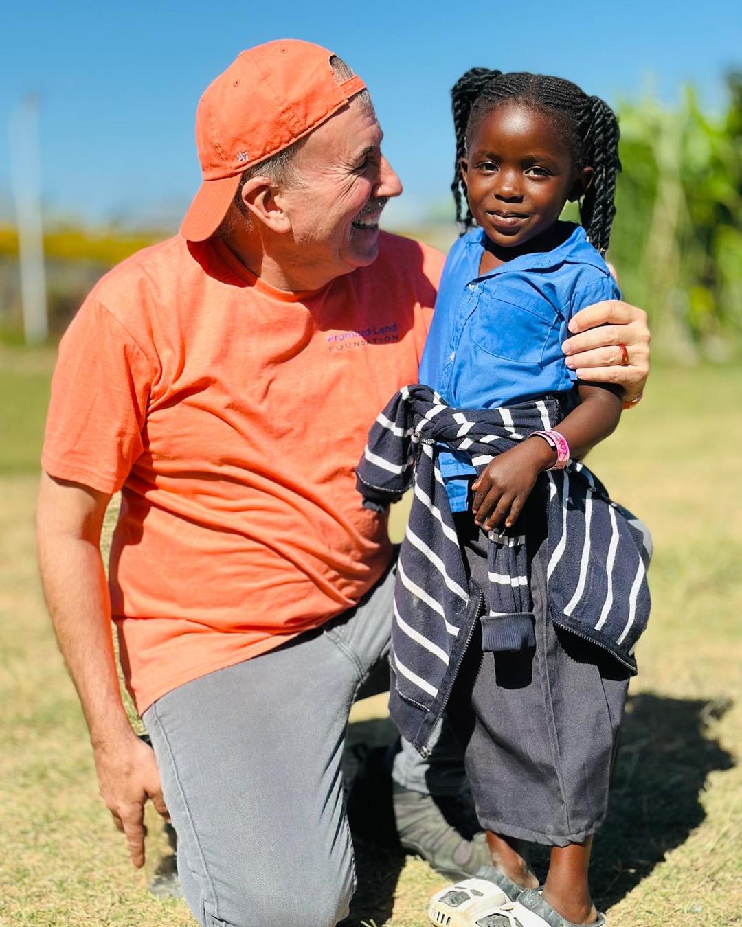 Tim with Child in Zambia